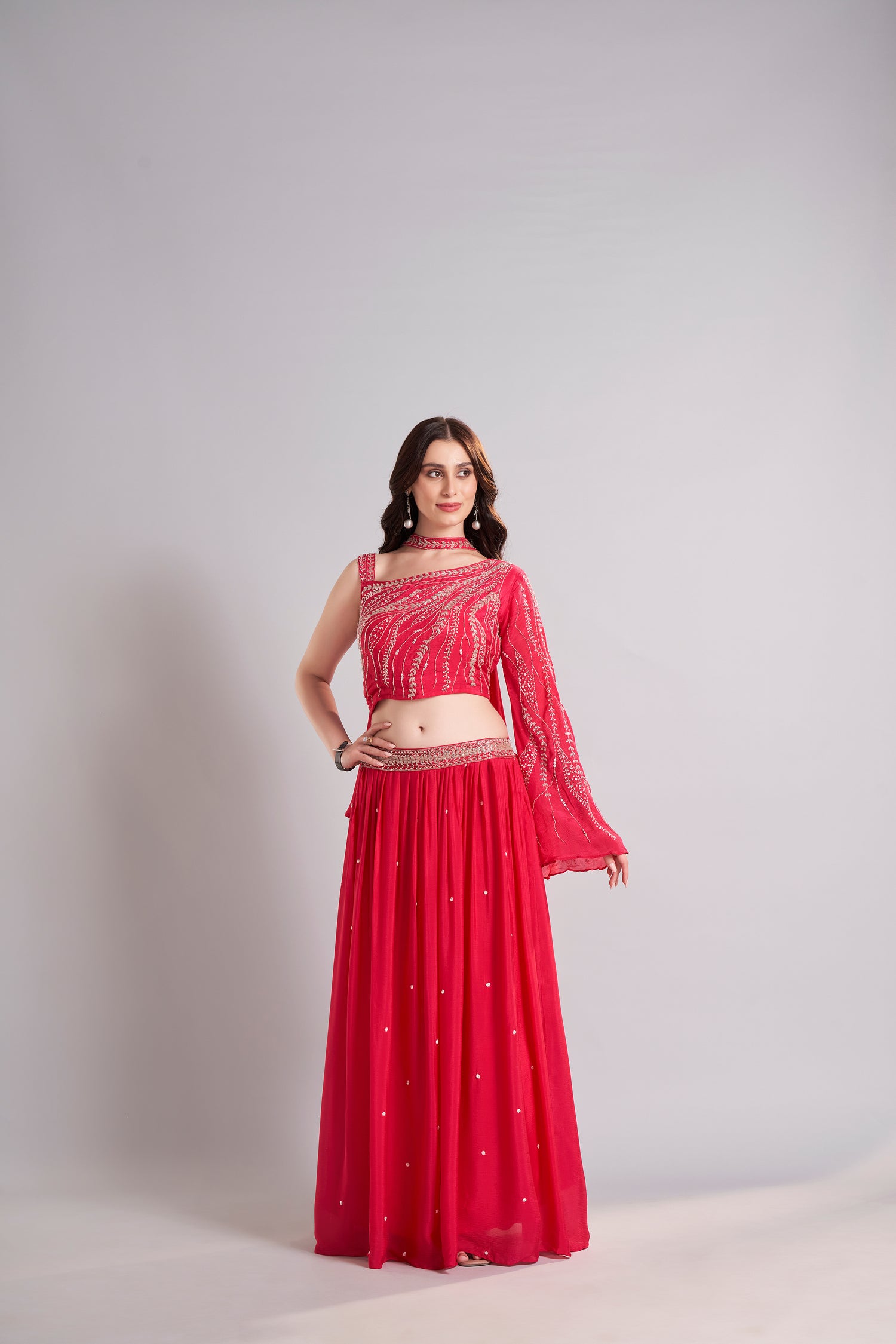 Crimson Red One-Shoulder Embellished Crop Top with Flowing Skirt – Glamorous Sangeet & Cocktail Outfit