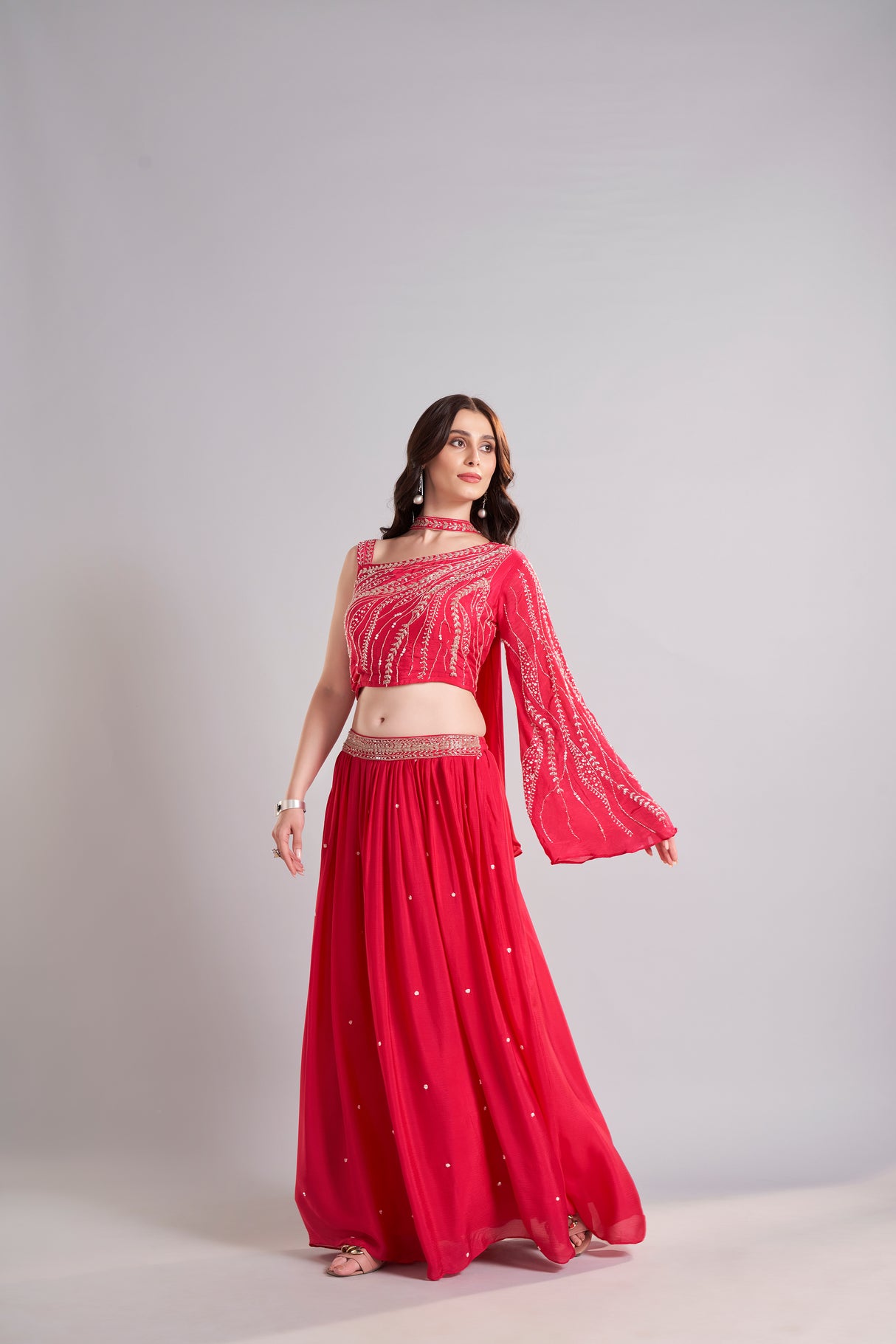 Crimson Red One-Shoulder Embellished Crop Top with Flowing Skirt – Glamorous Sangeet & Cocktail Outfit