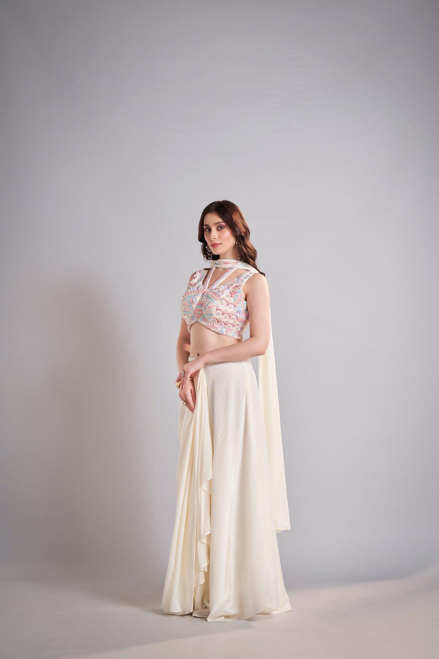 Ivory Draped Skirt with Pastel Embellished Crop Top & Flowing Drapes – Modern Wedding Reception Outfit