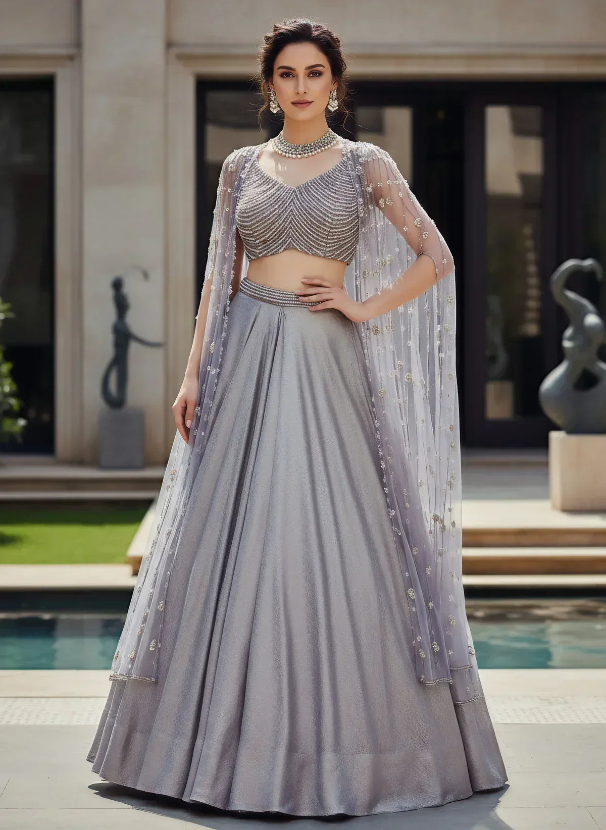 Silver Metallic Lehenga Set with Pearl Embellished Blouse and Net Cape - MishUUU