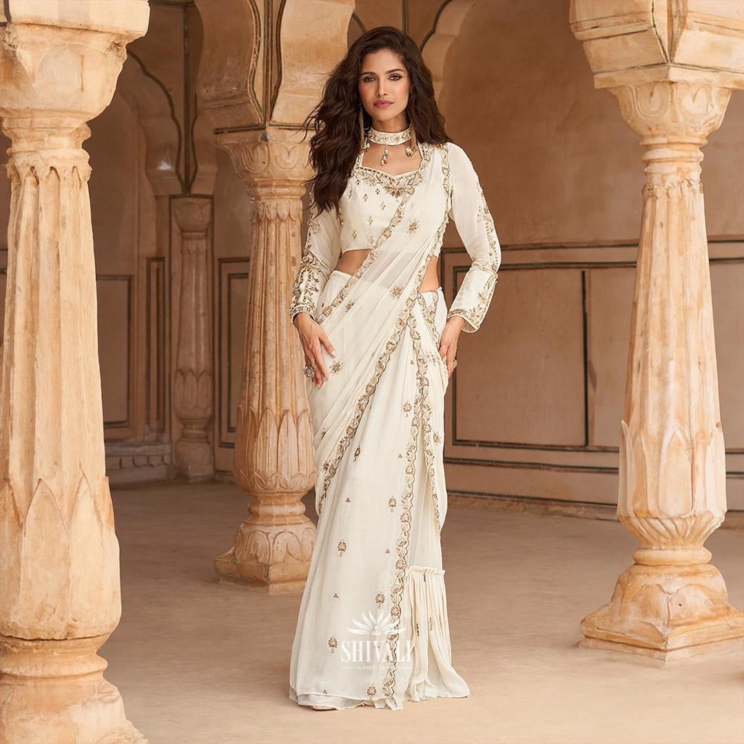 Ivory handcrafted saree with embellished blouse, draped in the classic Nivi style