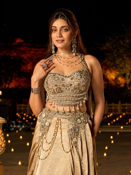 Champagne gold lehenga set with a pearl embellished crop blouse and flared draped skirt