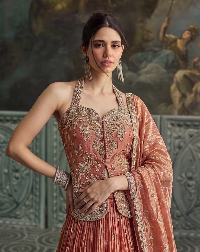 Vintage rose lehenga set with antique gold floral threadwork, suited to a National Capital Region reception