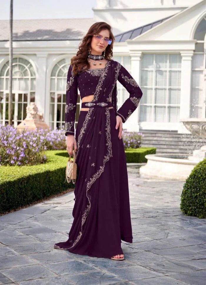 Deep plum embroidered lehenga set worn as a wedding family outfit