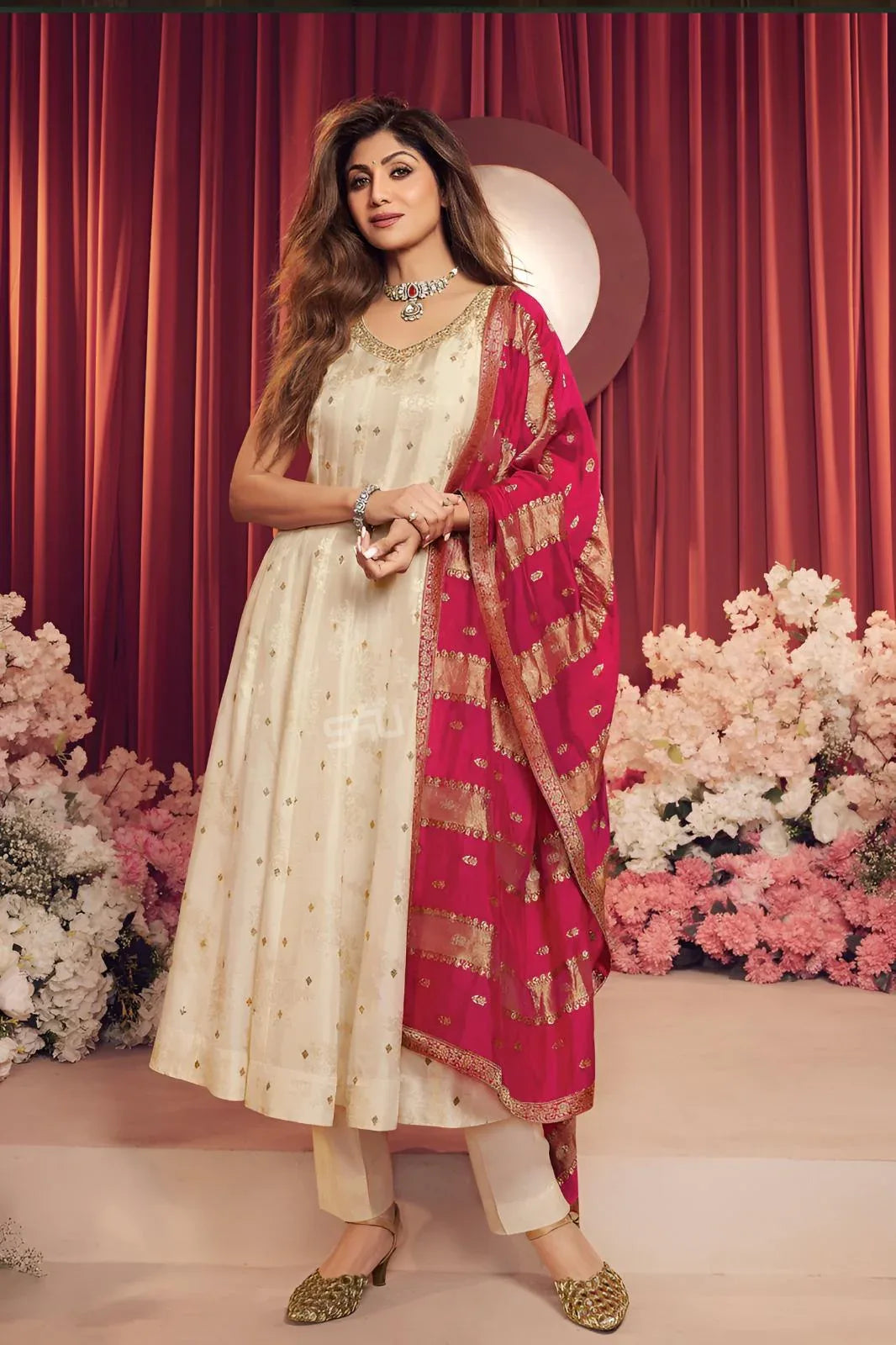 Ivory anarkali with rani pink and zari detailing for a civil wedding ceremony