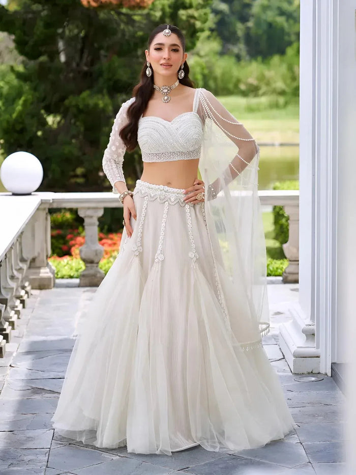 Ivory lehenga set photographed for a made-to-measure fitting guide