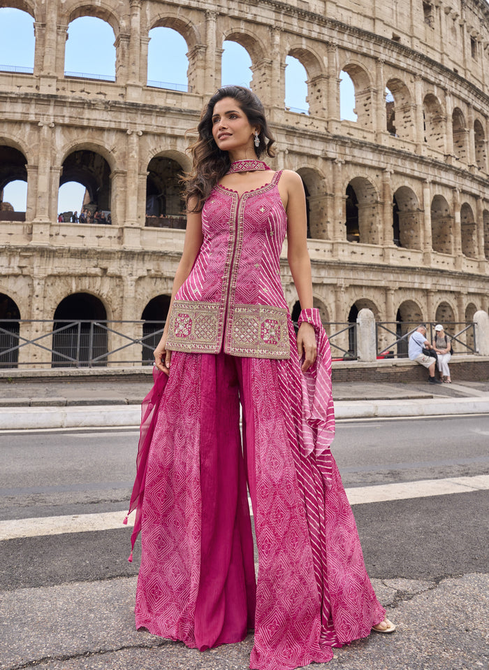 Rani pink bandhani sharara ensemble with antique gold work and a matching dupatta
