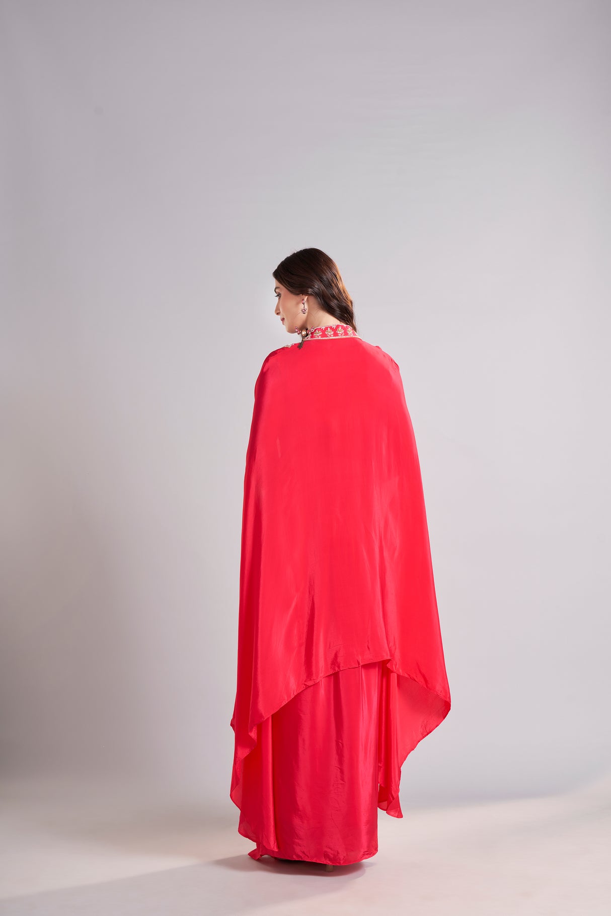 Radiant Red Draped Saree with Embroidered Crop Top & Cape Jacket – Designer Wedding & Festive Outfit