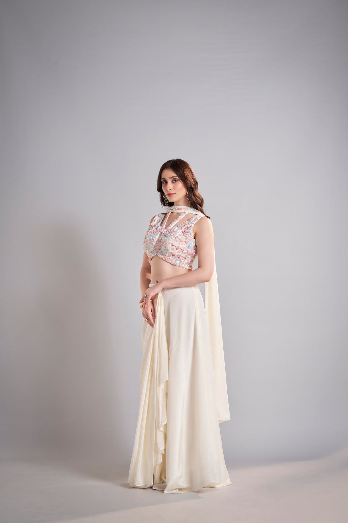 Ivory Draped Skirt with Pastel Embellished Crop Top & Flowing Drapes – Modern Wedding Reception Outfit