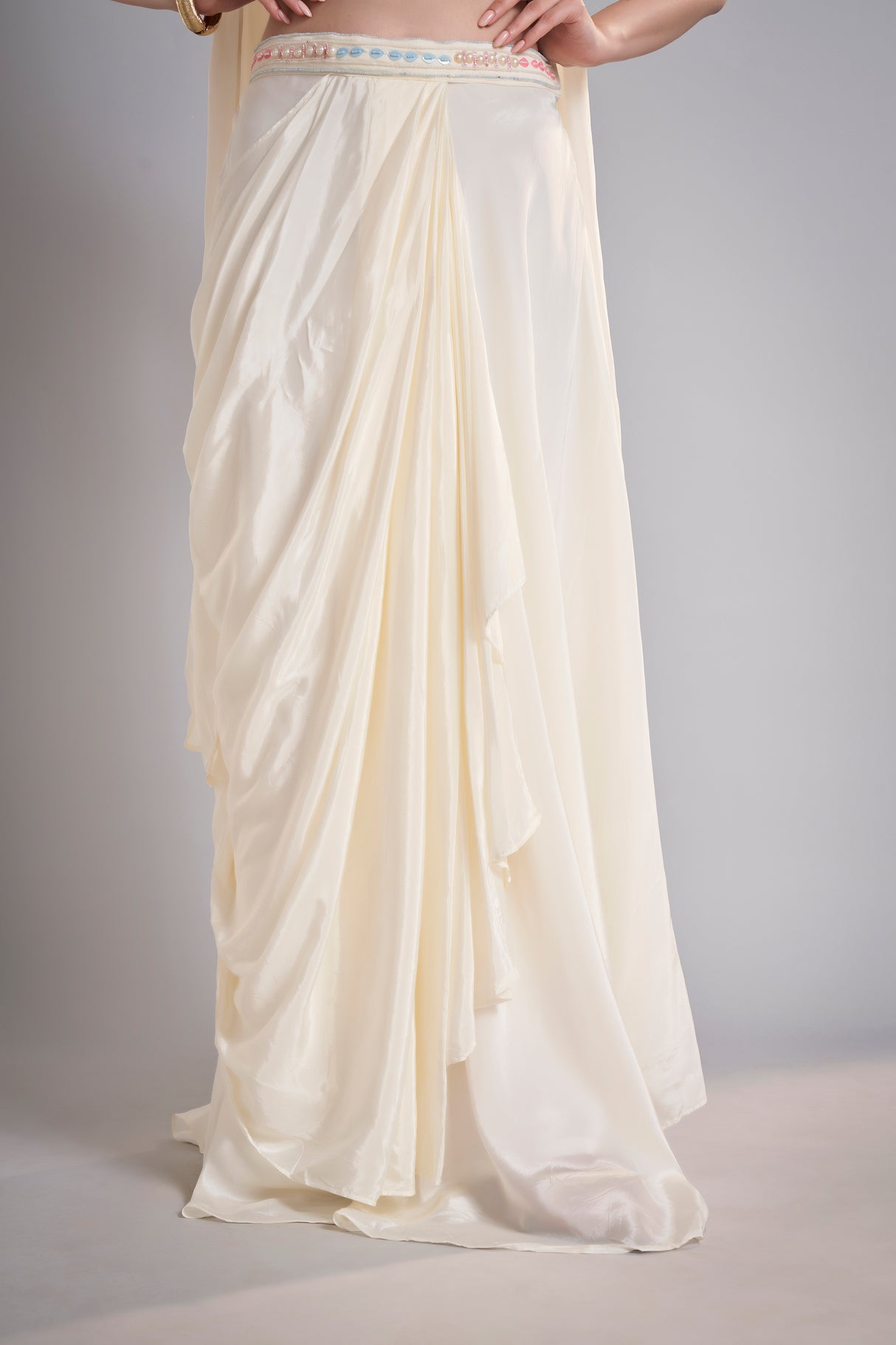 Ivory Draped Skirt with Pastel Embellished Crop Top & Flowing Drapes – Modern Wedding Reception Outfit