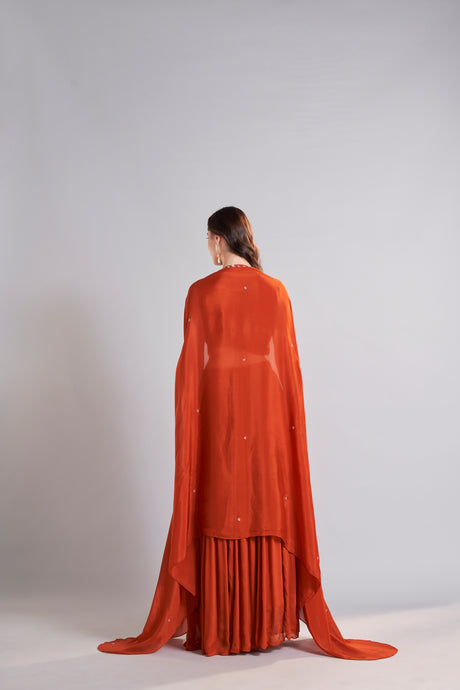 Rust Orange Embroidered Crop Top with Flowy Skirt & Cape Overlay – Festive Wedding Lehenga Set