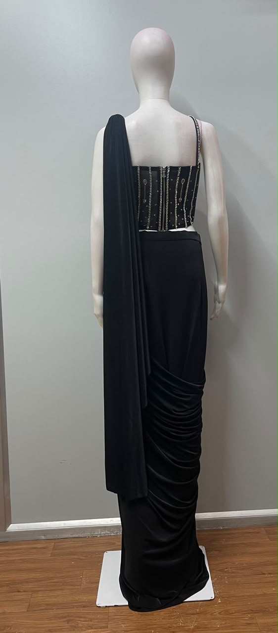 Black silver embellished pre-draped saree styled for an evening