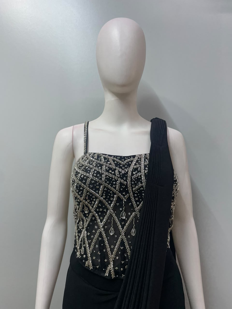 Detail of the pleated pallu on a black silver embellished saree