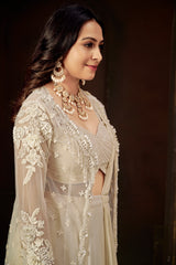 Ivory Ruffle Layered Georgette Lehenga Set with Embroidered Sheer Cape & Draped Corset Blouse – Minimalist Luxe Couture