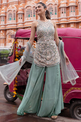 Seafoam palazzo set with silver mirrorwork across the sleeveless kurta