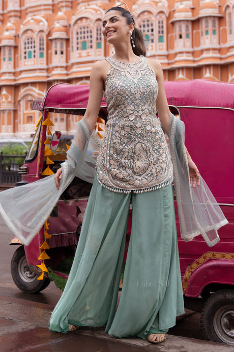 Seafoam palazzo set with silver mirrorwork across the sleeveless kurta
