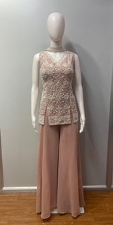 Full-length view of a dusty rose pearl jewel palazzo set on the model