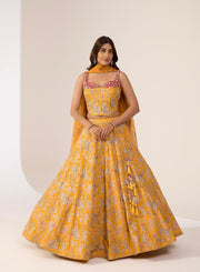 Marigold lehenga with paisley motifs, a matching blouse and dupatta