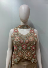 Close view of the floral embroidery on a peach champagne lehenga