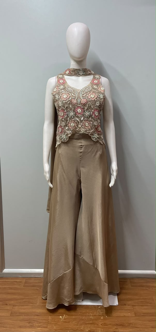 Full-length view of a peach champagne floral embroidered lehenga
