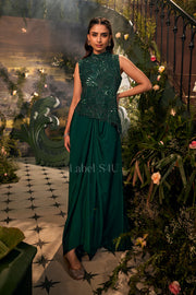 Emerald and black draped couture set with a softly flowing drape