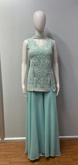 Full-length view of an aqua mint silver jewel palazzo set on the model
