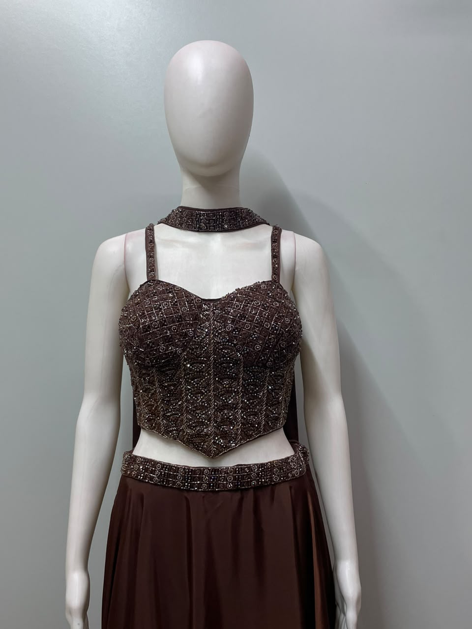 Detail of the flared hem on a chocolate bronze anarkali gown