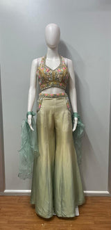 Seafoam mirror palazzo set photographed against a plain backdrop