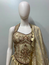 Full-length view of an ivory gold corset embroidered lehenga set