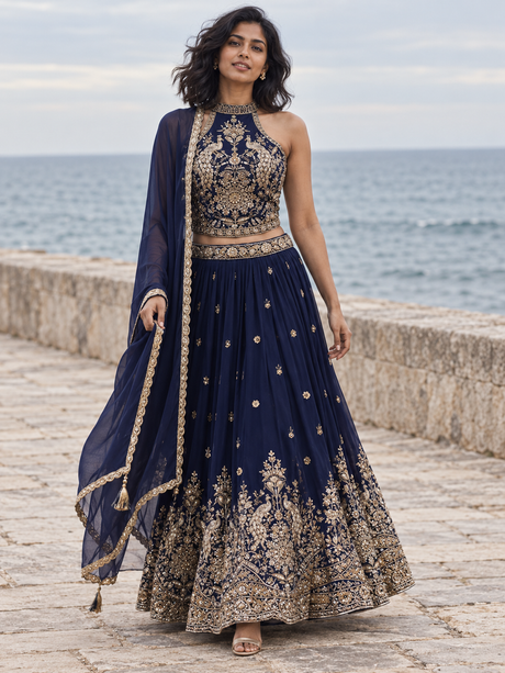 Royal blue lehenga set with gold peacock zari work and a halter blouse