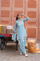 Close view of the embroidery on a powder blue kurta and dupatta