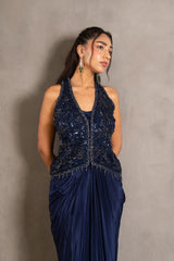 Close view of the embroidery on a midnight navy draped saree