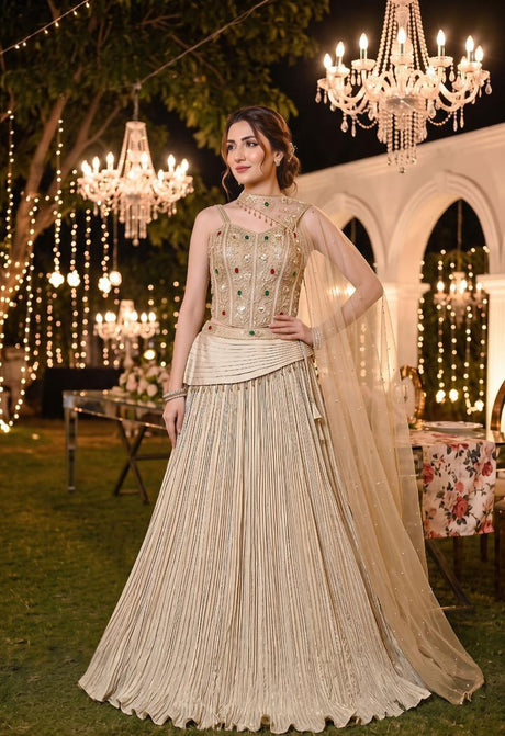 Champagne gold corset lehenga with jewel accents and deep pleats