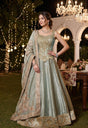 Seafoam green corset lehenga with antique gold beadwork and a floral bordered dupatta