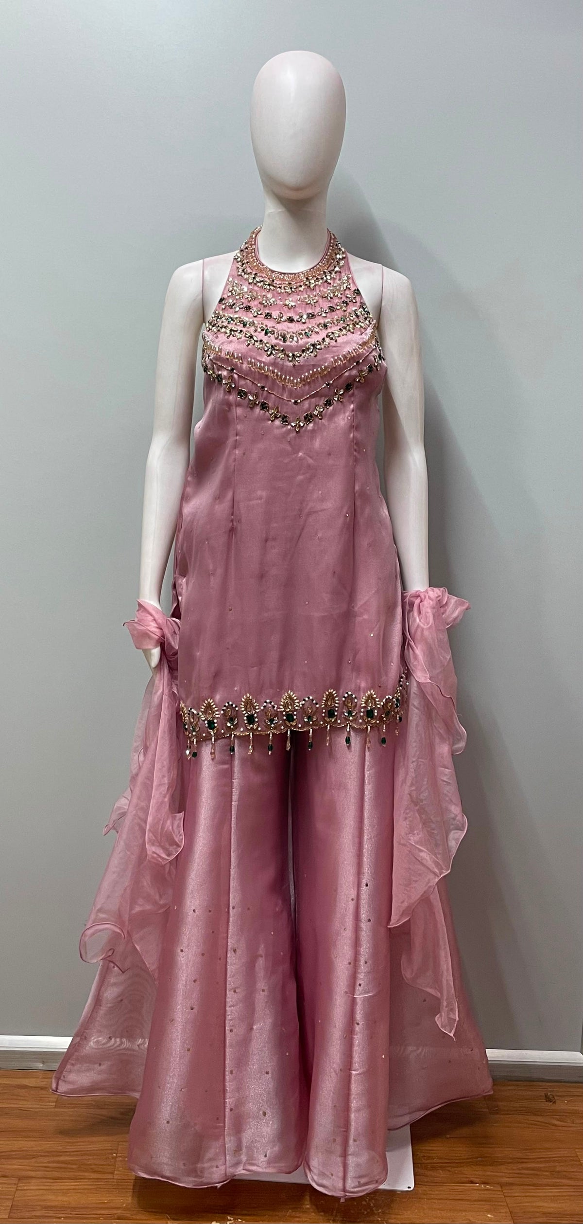 Close view of the jewel embellishment on a blush mauve kurta