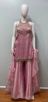 Close view of the jewel embellishment on a blush mauve kurta