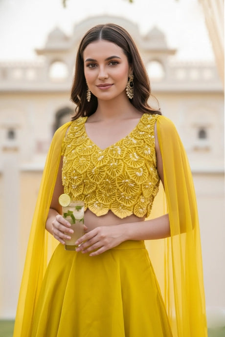 Sunshine Yellow Layered Lehenga with 3D Floral Blouse and Draped Cape – Haldi & Summer Wedding Guest Outfit