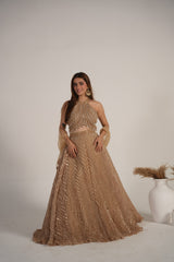 Detail of the halter neckline on a champagne shimmer lehenga