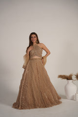 Champagne shimmer halter lehenga styled for an evening celebration