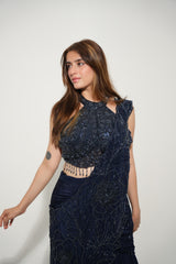 Midnight blue embellished lehenga photographed against a plain backdrop