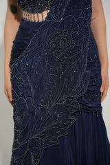 Back view of a midnight blue embellished lehenga skirt and blouse