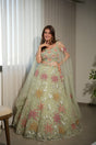 Sage net lehenga with floral work and a matching blouse and dupatta