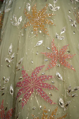 Sage floral net lehenga set styled for a daytime celebration