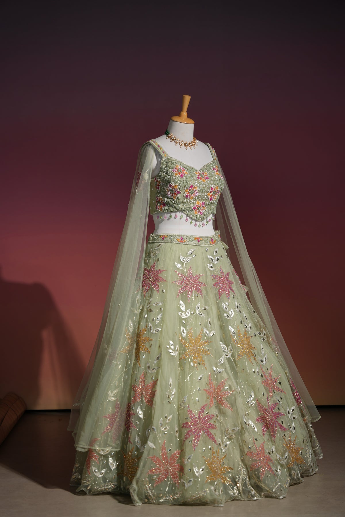 Sage green floral net lehenga set, alternate styling on the model