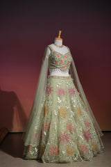 Sage green floral net lehenga set, alternate styling on the model