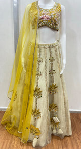 Mustard floral lehenga choli set styled for a haldi celebration