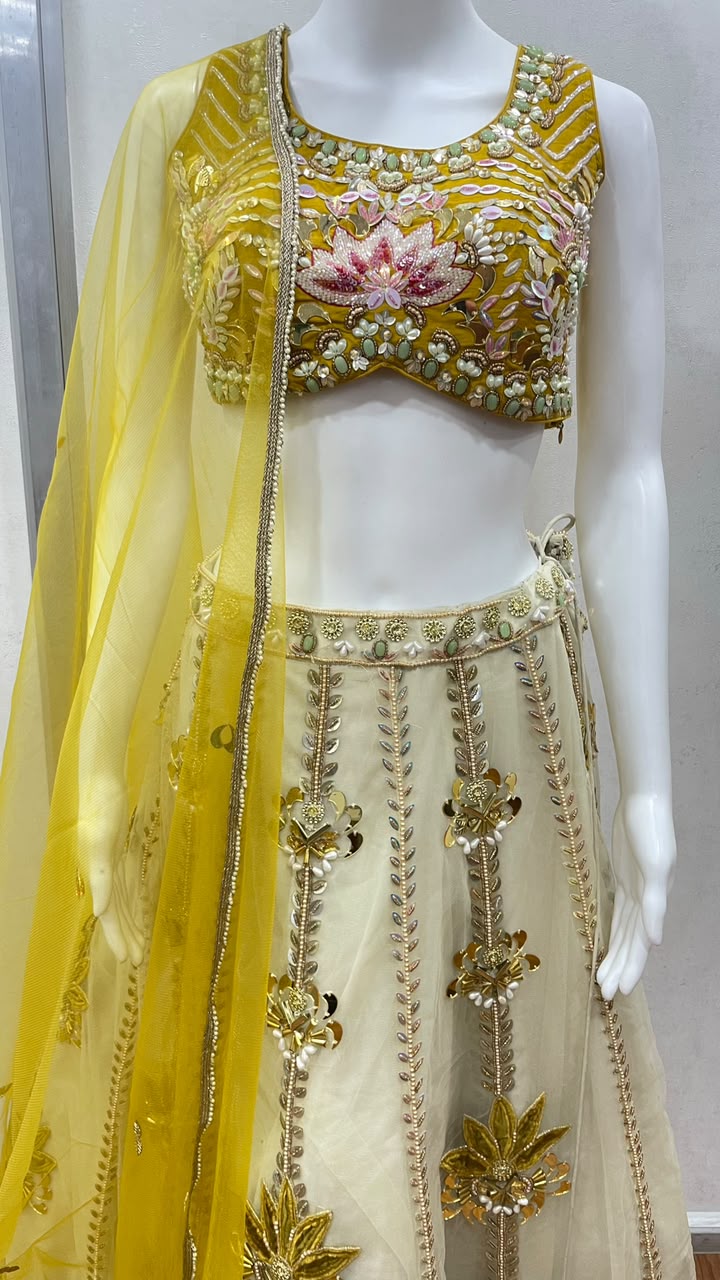 Detail of the choli neckline on a mustard floral lehenga set