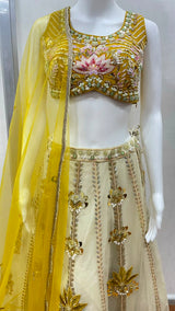 Detail of the choli neckline on a mustard floral lehenga set