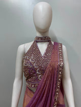 Full-length view of a mauve bronze embellished draped saree set