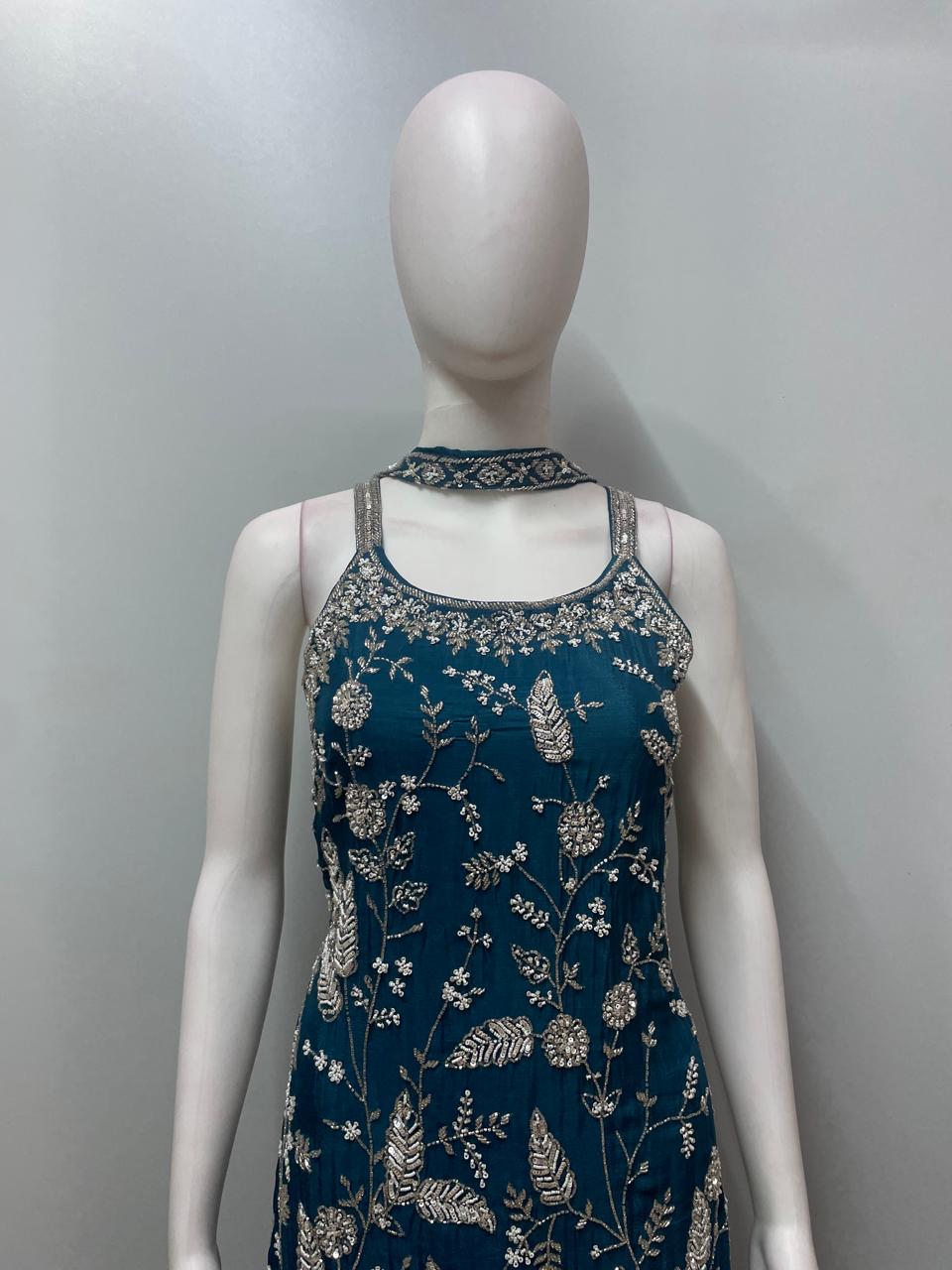 Detail of the layered hem on a teal embroidered sharara kurta set